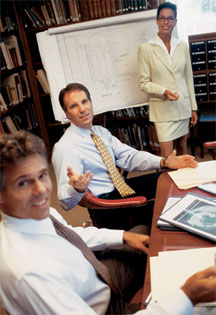 Photos of three working people around desk