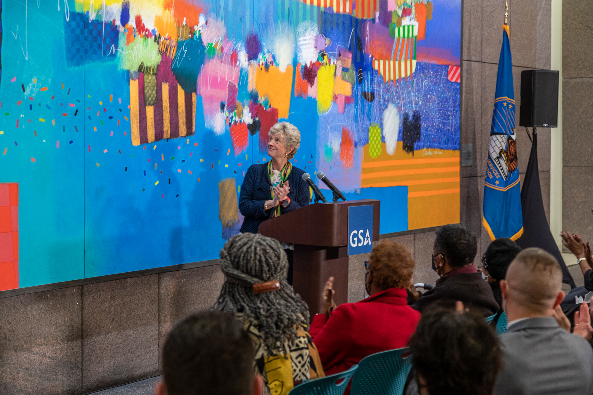 Administrator Carnahan in front of a piece of artwork