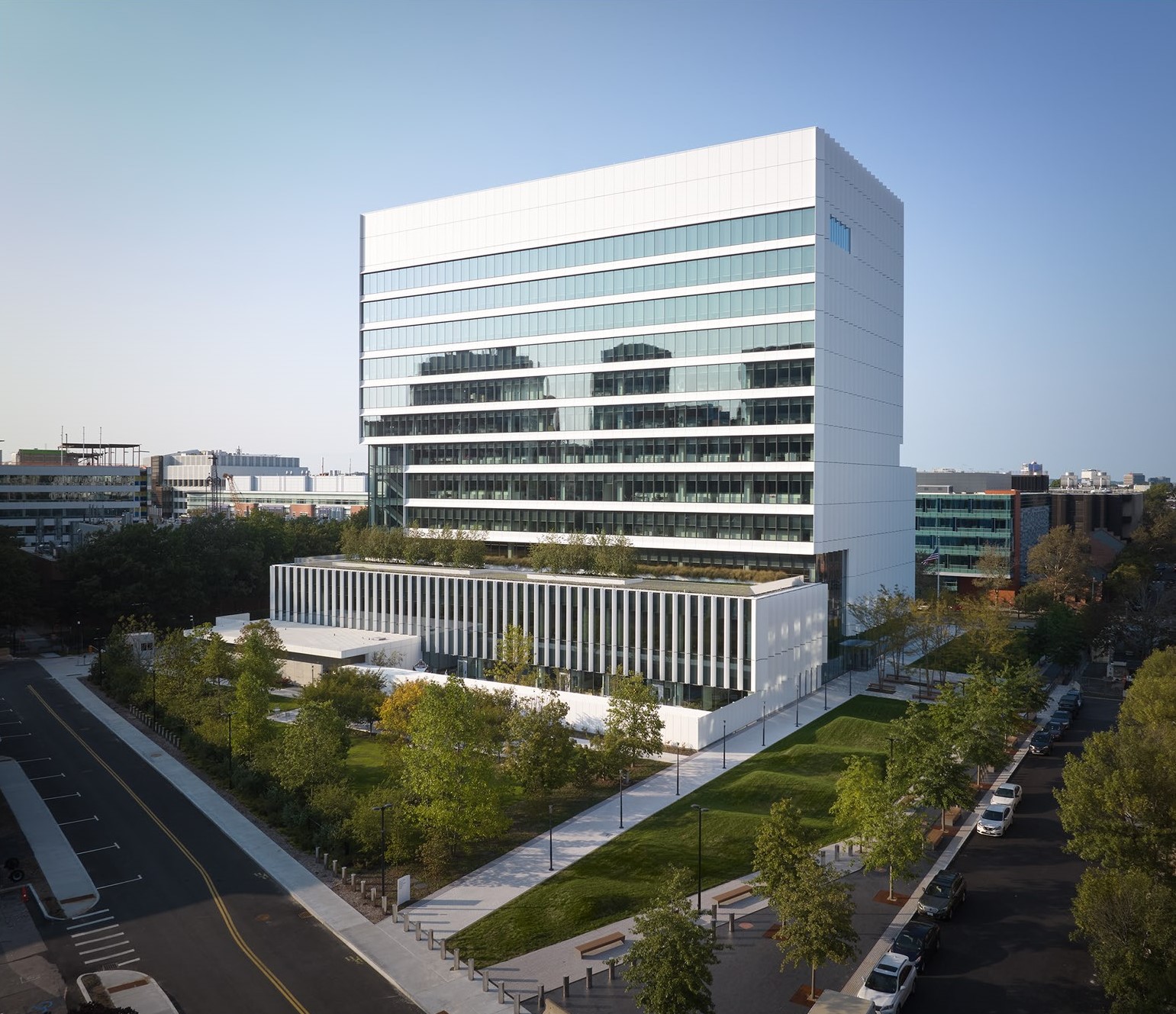 aerial shot of the Volpe building with grass in front