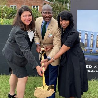 Nine Judge and Mayor holding shovel with dirt