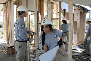 Americorps members working on flood recovery in T