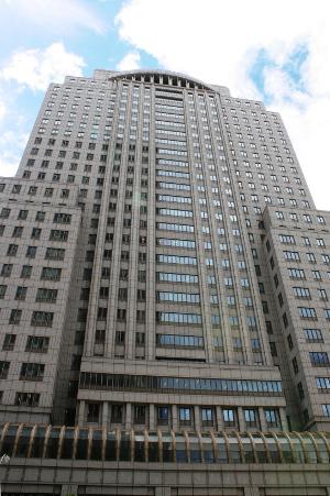 A high-rise office building with an arched top.