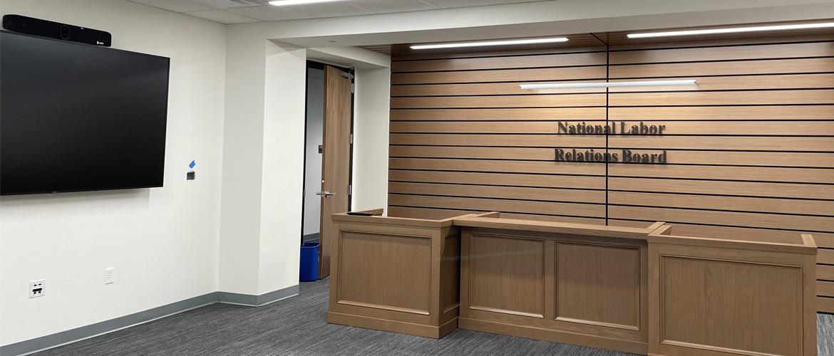 New NLRB office space at the Garmatz U.S. Courthouse in Baltimore features modern lighting and unique wood slatting.