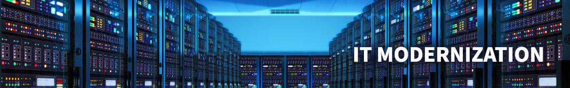 View down the hall in a dark data center with blue lights with text IT Modernization in white