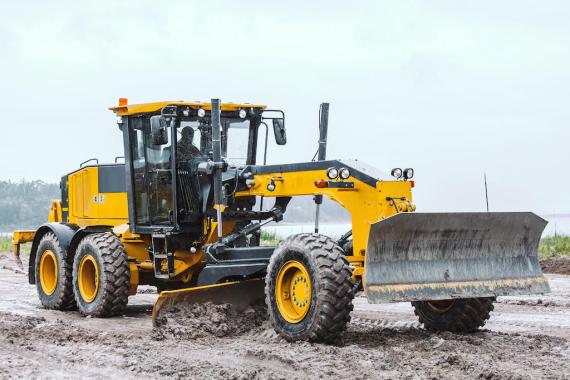 Stock image of a A John Deere Motor Grader in use.