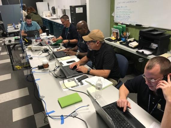 The Office of Mission Assurance at the Hurricane Harvey Joint Field Office sitting at desks