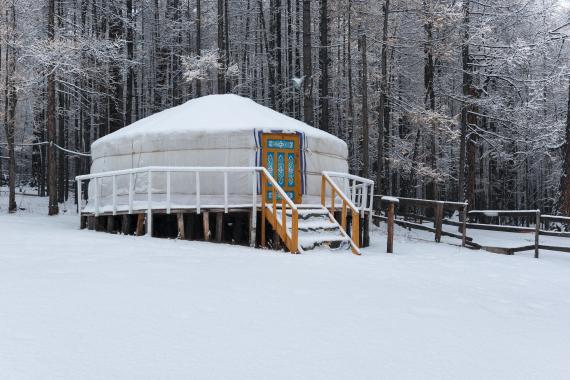 stock image of a yurt in a snowy clearing
