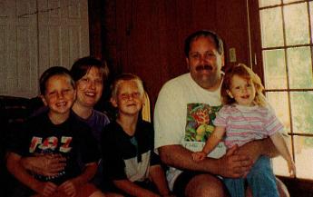 Santella poses for a photo with his wife Charlotte and their kids Nicholas, Frank & Christine in 1999.