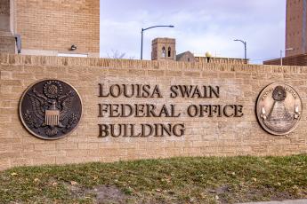 Marquee sign that reads Louisa Swain Federal Office Building