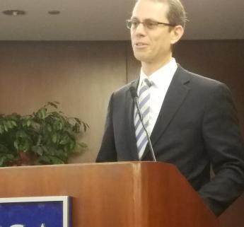 Close-up of PBS Commissioner Dan Mathews at podium
