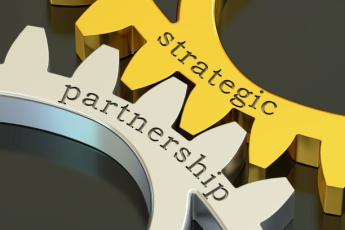 Two gears that say strategic and partnership working together.