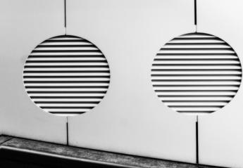 Photo showing two circular HVAC vents