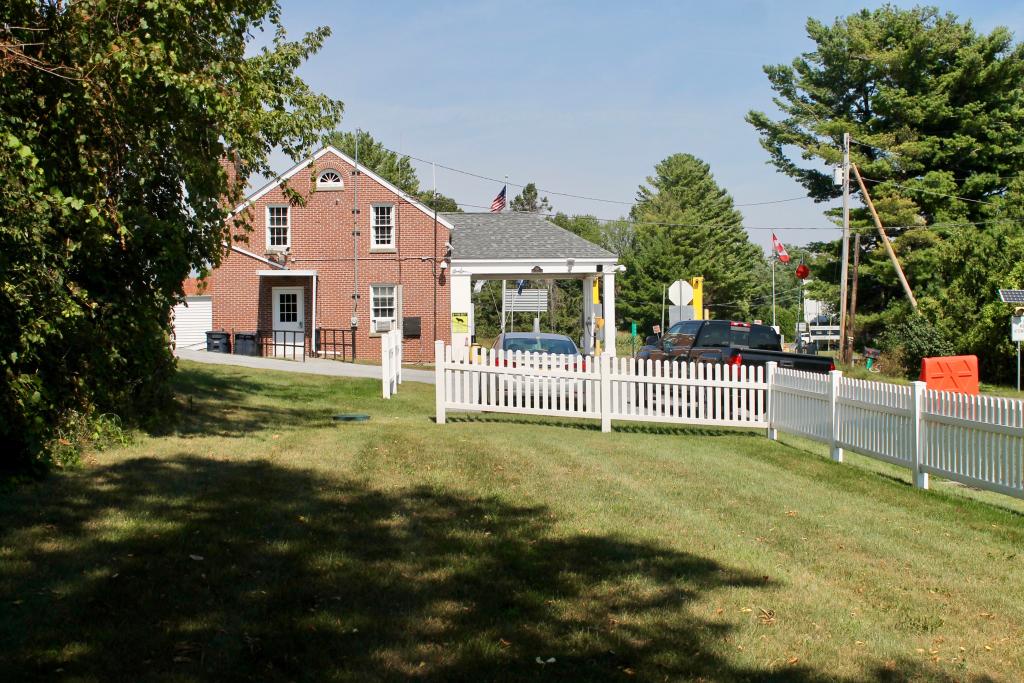looking at the brick building from the grass