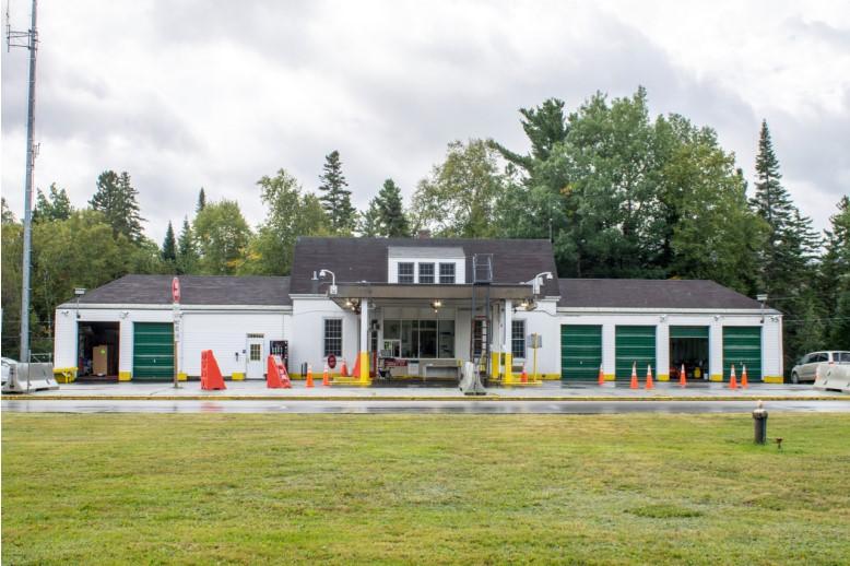 panoramic view of the building with grass in the front
