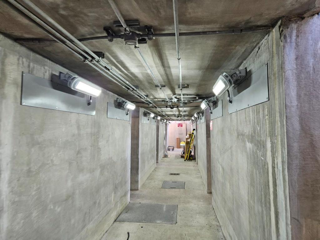 Wall mounted lights inside a tunnel