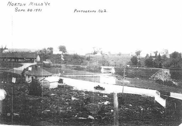 black and white photo of the old port with a small car driving through
