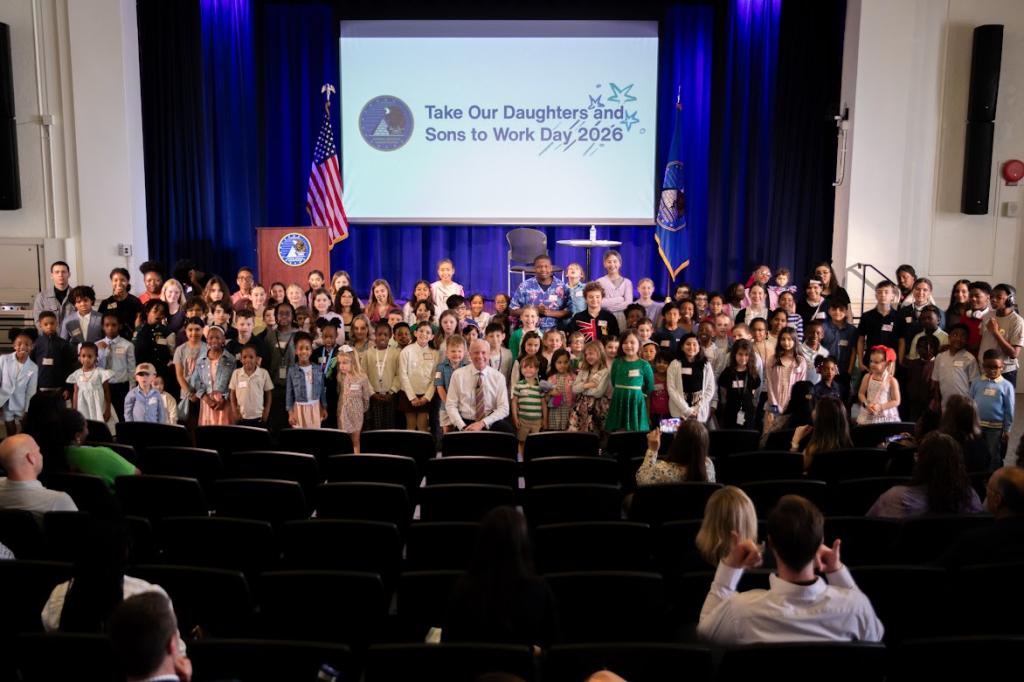 Group photo of employees and children on Take Our Daughters and Sons to Work Day