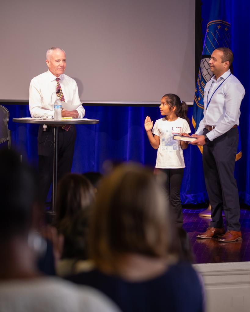 Adminstrator Forst on Take Our Daughters and Sons to Work Day with a child and employee