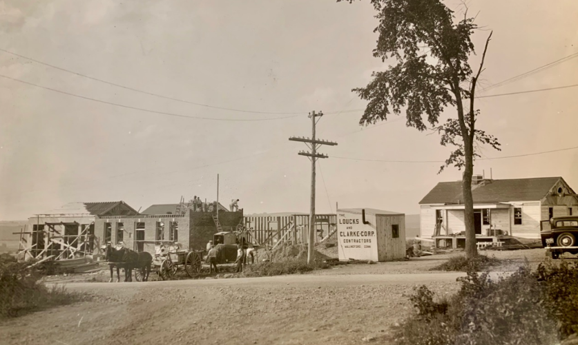 black and white photo of the land port of entry being build