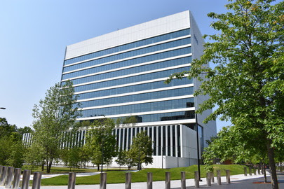 a building with trees and grass